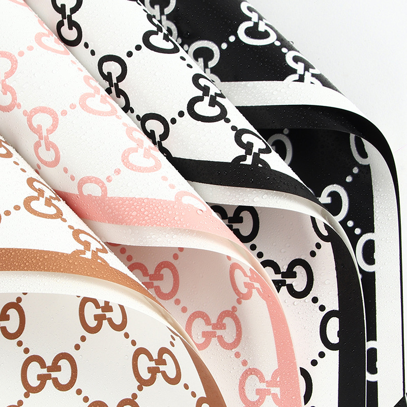 LR Guci Logo Floral Wrapping Paper Design