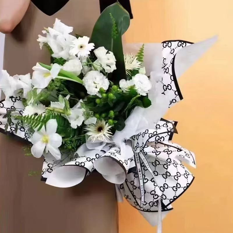 LR Guci Logo Floral Wrapping Paper Design