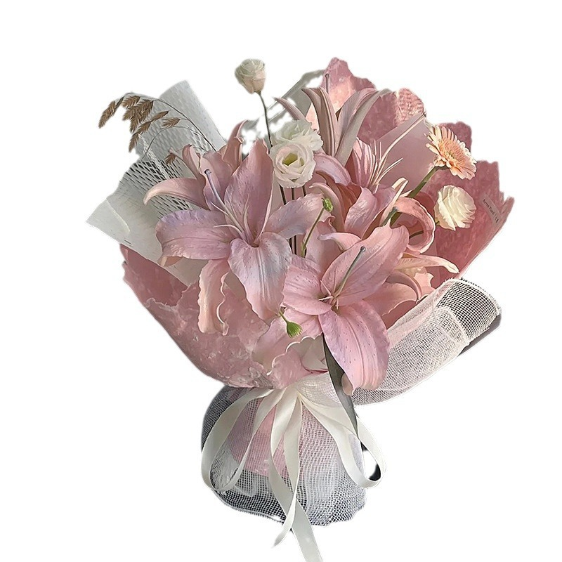 Pink floral wrapping paper with hand-torn edges.