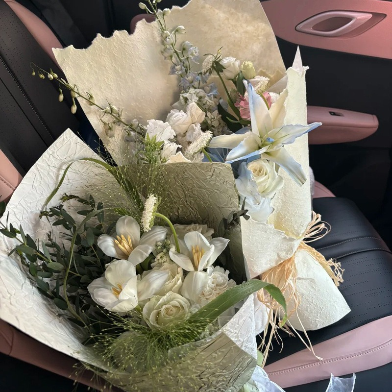 Pink floral wrapping paper with hand-torn edges.