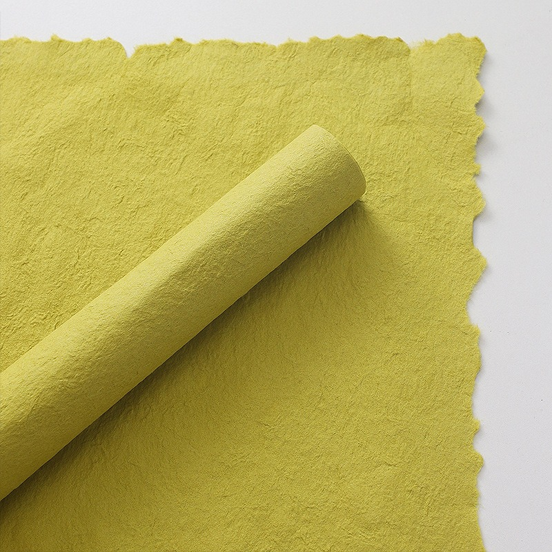 Pink floral wrapping paper with hand-torn edges.